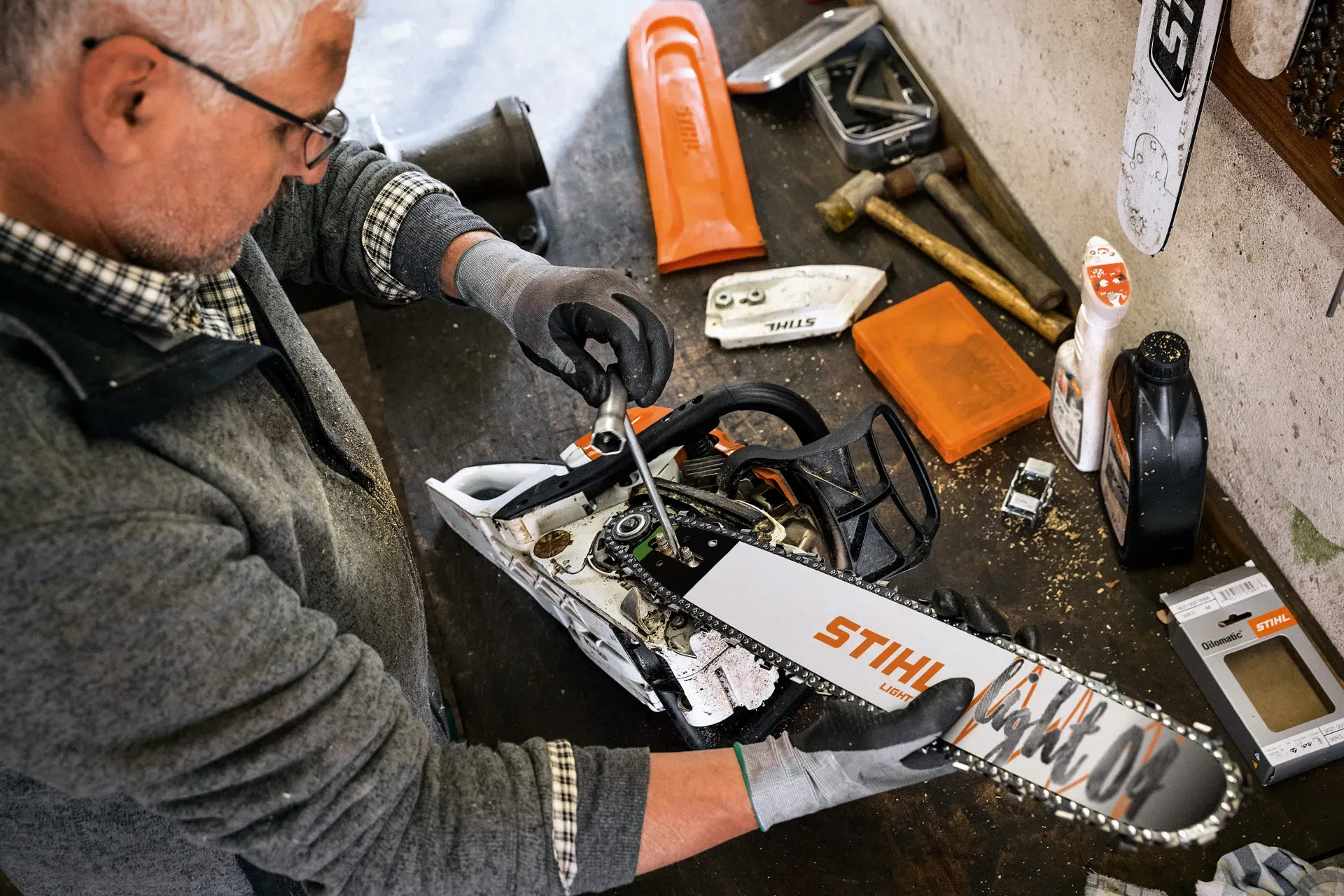 Outdoor gear being inspected and serviced on a workbench