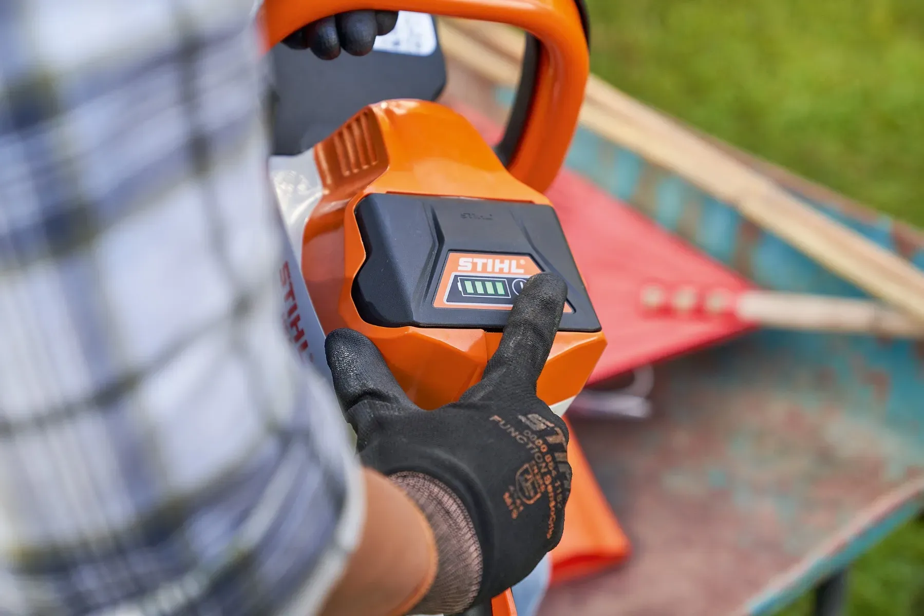 STIHL battery tools being charged in a Kiwi garage