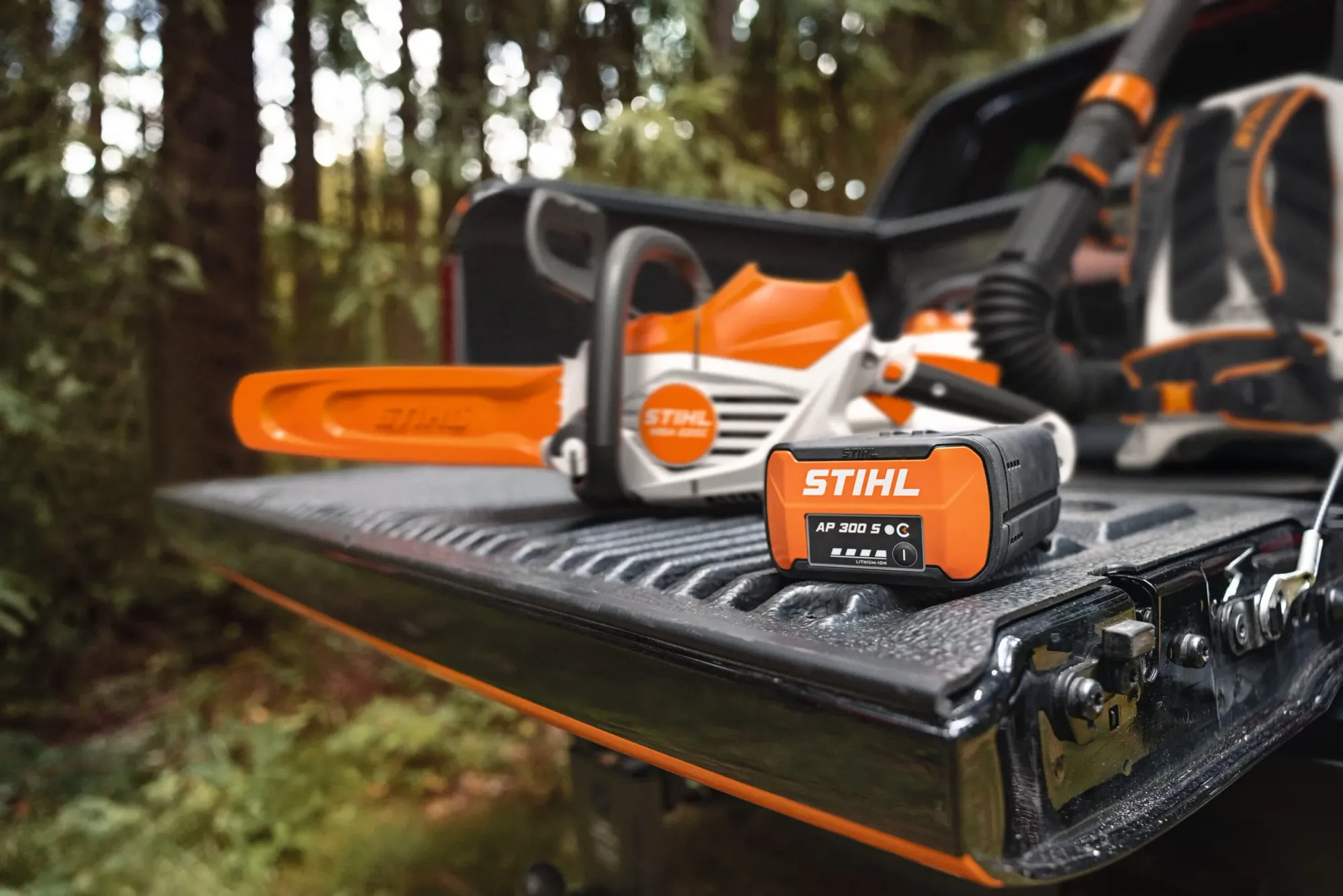 Side-by-side comparison of petrol and battery outdoor power equipment