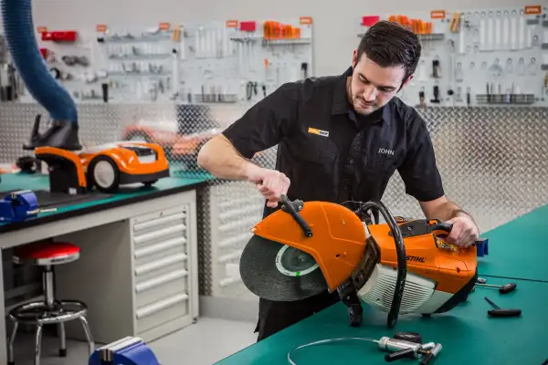 A STIHL technician repairing outdoor equipment alongside a DIYer doing a quick fix