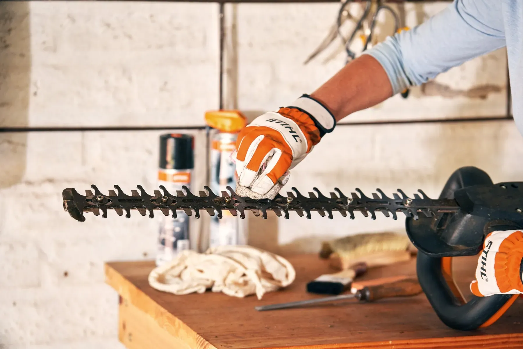 A STIHL technician working on outdoor power equipment in a certified workshop